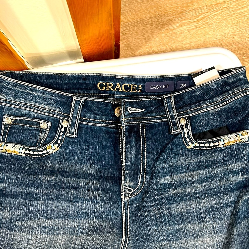Size 28, Grace jeans! Worn once, in good shape.